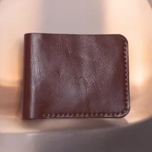 The Gazelle by Indus Hide, a handmade leather bifold wallet available in reddish brown and camel brown.