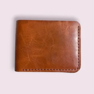 The Moor by Indus Hide - A reddish brown handmade bifold leather wallet.