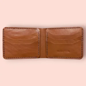 Interior view of The Thar by Indus Hide, a camel brown handmade leather bifold showcasing 6 precision-cut T-slots and premium hand-saddle stitching.